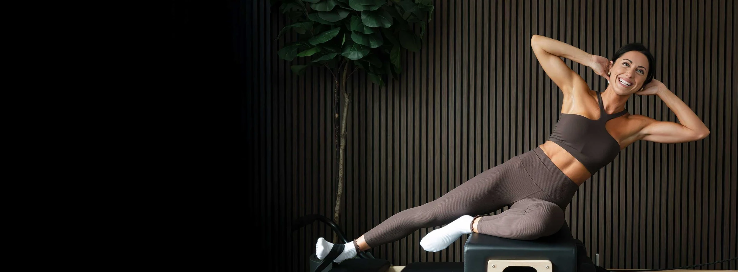 Leah Maselli on a Pilates reformer