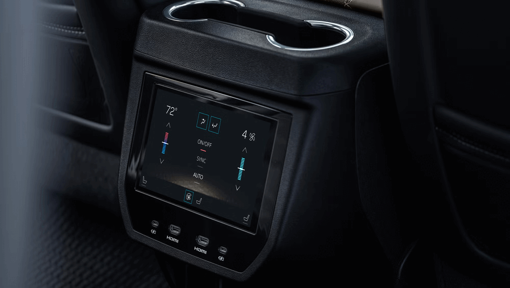 A car's rear seat display screen showing climate control settings with temperature at 72 degrees, fan speed at 4, and various icons for functions like auto, sync, and air circulation.