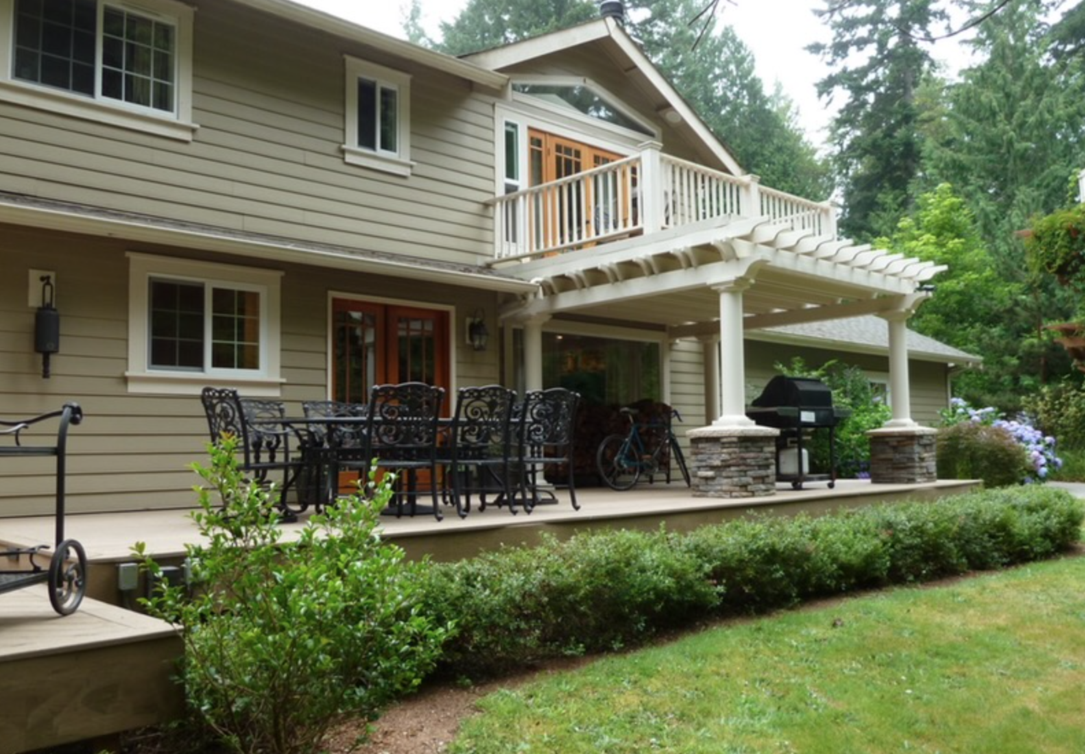 Back of Residence - AFTER - 
Deck off master suite upstairs added, wrap around deck below with pergola, outdoor dining area and fire-it.