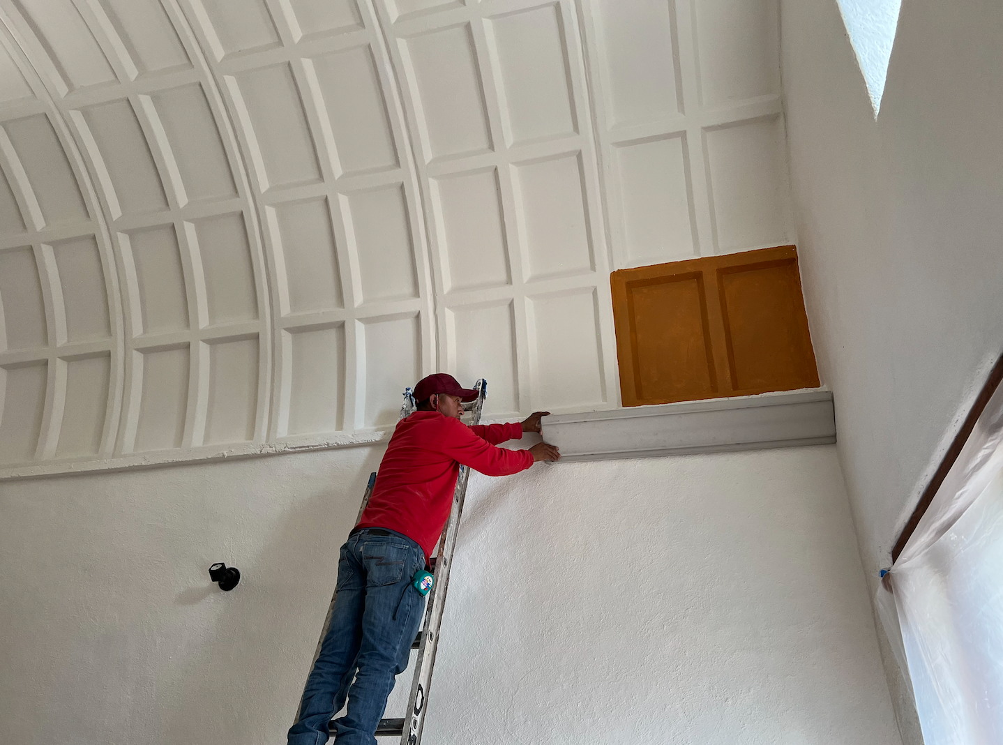 Cement painted white, the orange, then stained.