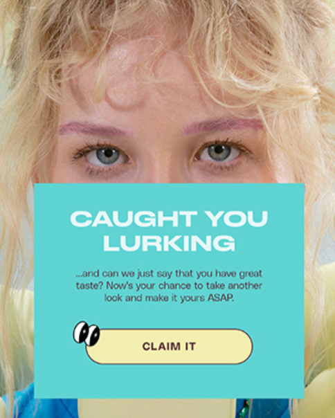 A person with blonde hair and blue eyes holds a sign that says "Caught You Lurking" with a message below encouraging to claim a prize.