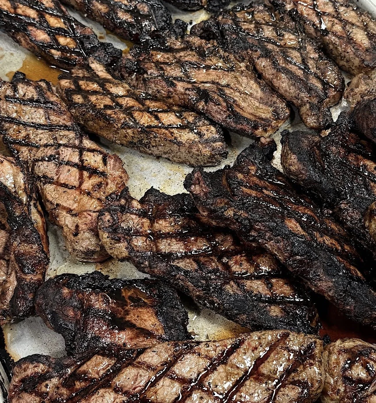 Grilled assorted steaks with crosshatch grill marks