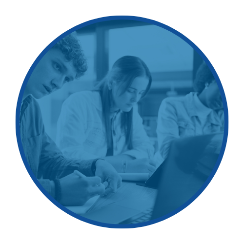 Group of students studying and taking notes in a classroom.