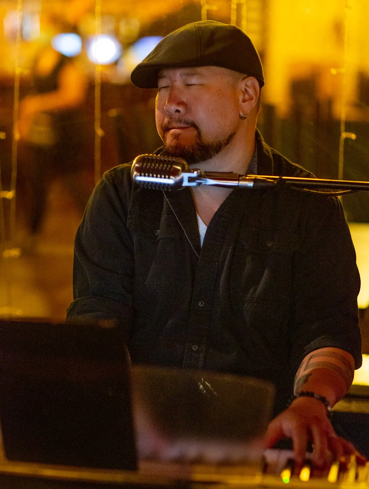 Stan Chang playing the piano at an event