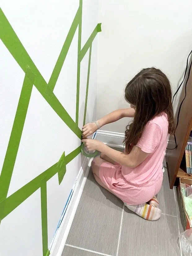 Prepping the design. The child had input and control over the design on the wall, making this project that much more special and exciting to see the room be transformed.