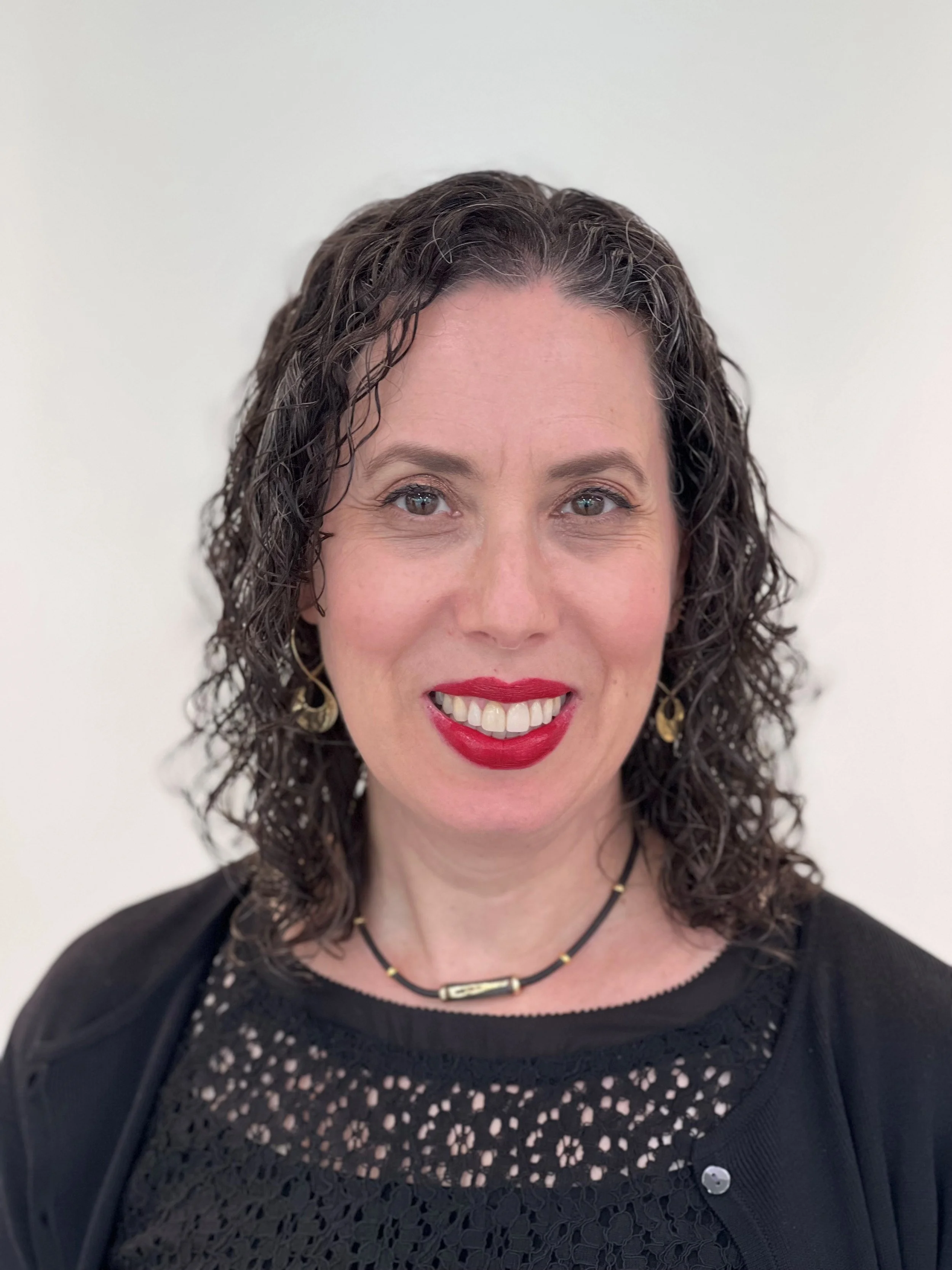 Professional head shot of Sarah Feinberg, mural artist