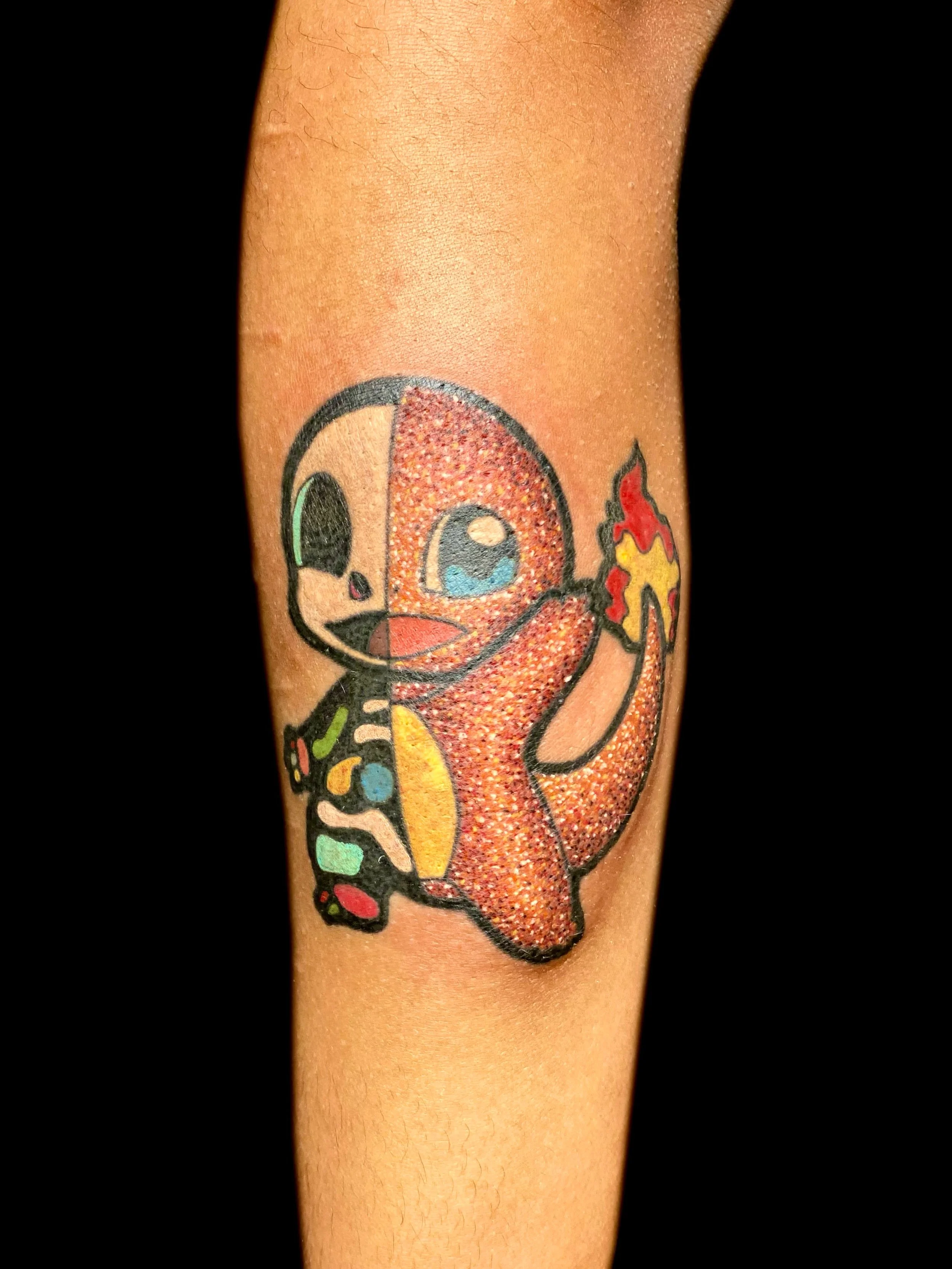 Glitter Pok&eacute;mon on dark skin tone. 
Big Thank you to Elize for your patience and trust. 

#glittertattoo #pdxtattoo #oregontattoo #pokemontattoo #darkskintattoos
