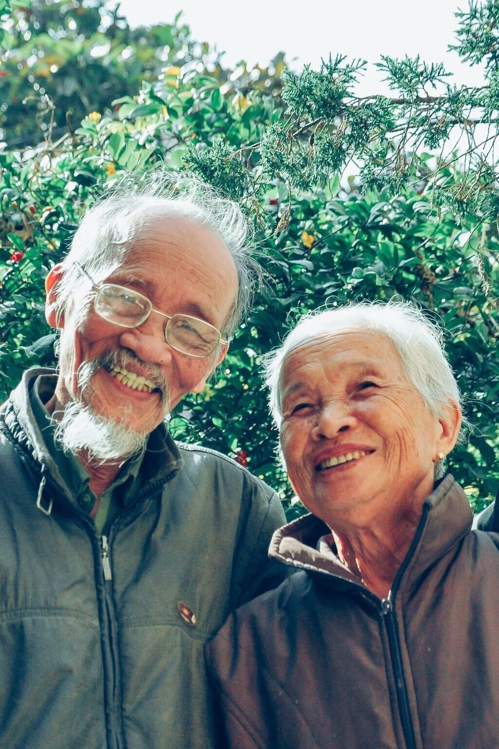 Various loaves of bread balancing on each other.
