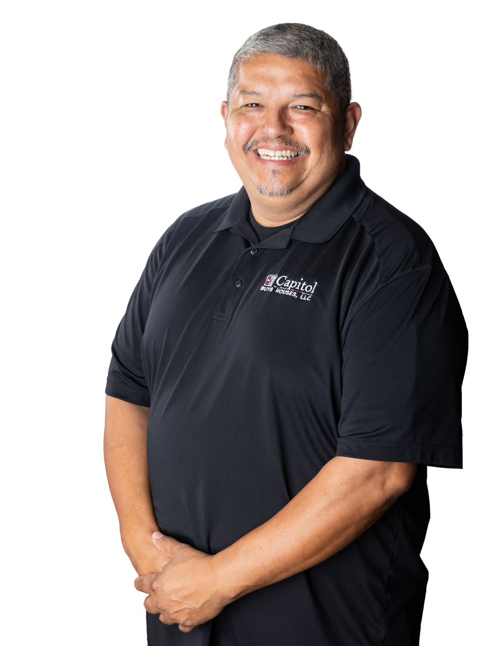 A smiling man wearing a black polo shirt with a logo that reads "Capitol BUYS HOUSES, LLC", posing against a plain background.