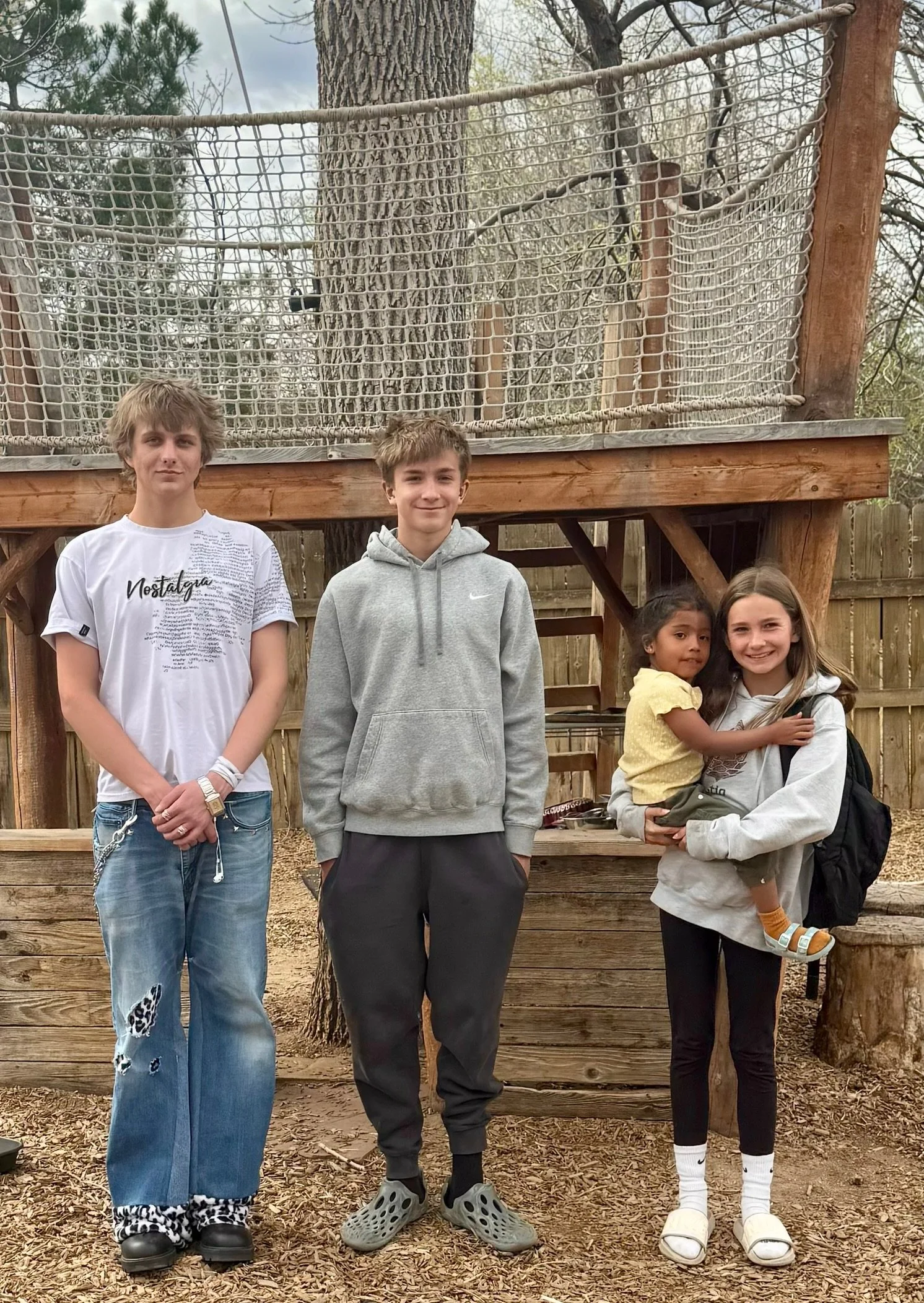 Alumnis in front of treehouse.jpg