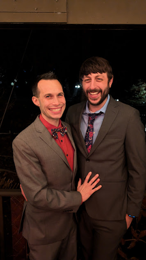 Larry and Rob celebrating at a friend's wedding