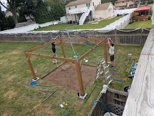 Larry and his cousin building a gazebo in our backyard
