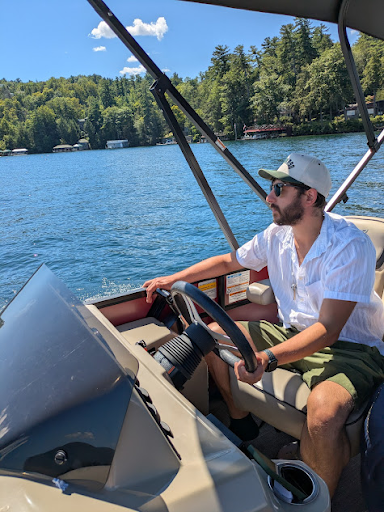 Larry driving the pontoon boat - he makes it look easy :)
