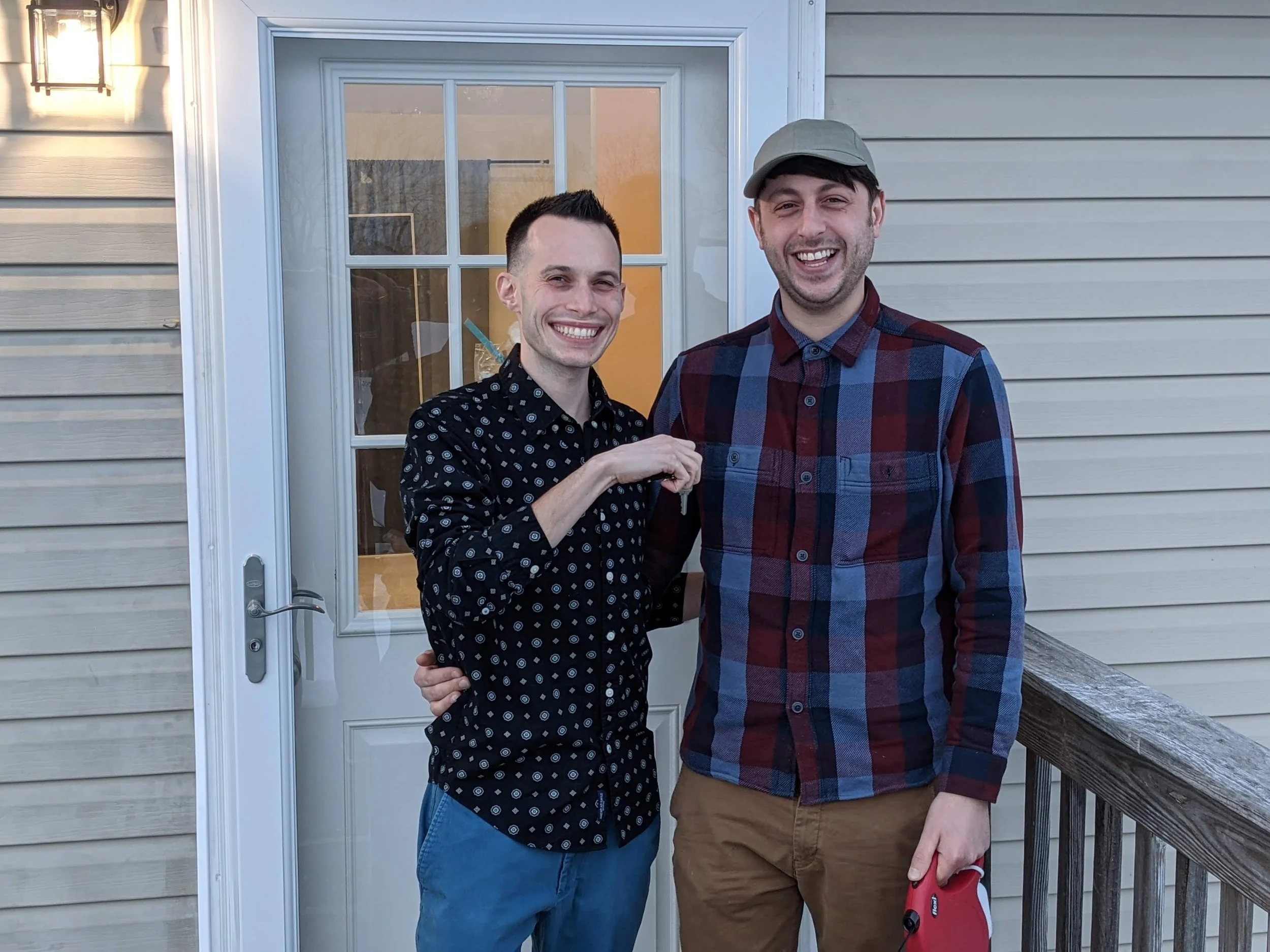 Larry and Rob getting the keys to their apartment