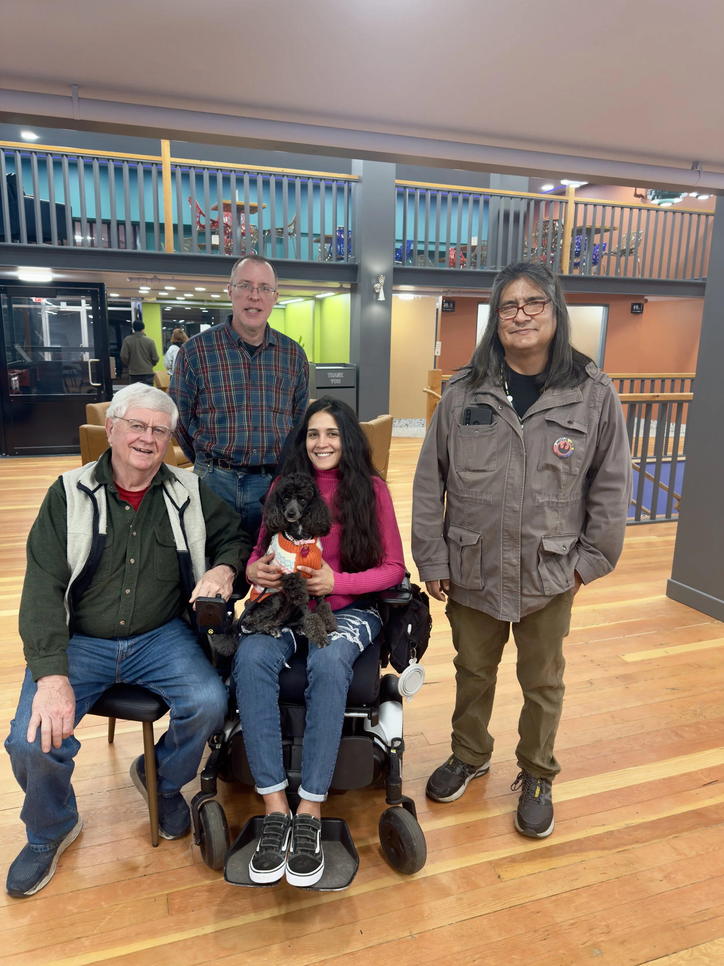 SAND members and volunteers gathered indoors during an Access Together community event, highlighting inclusive social activities that bring disabled and nondisabled people together to build friendships, connection, and community.