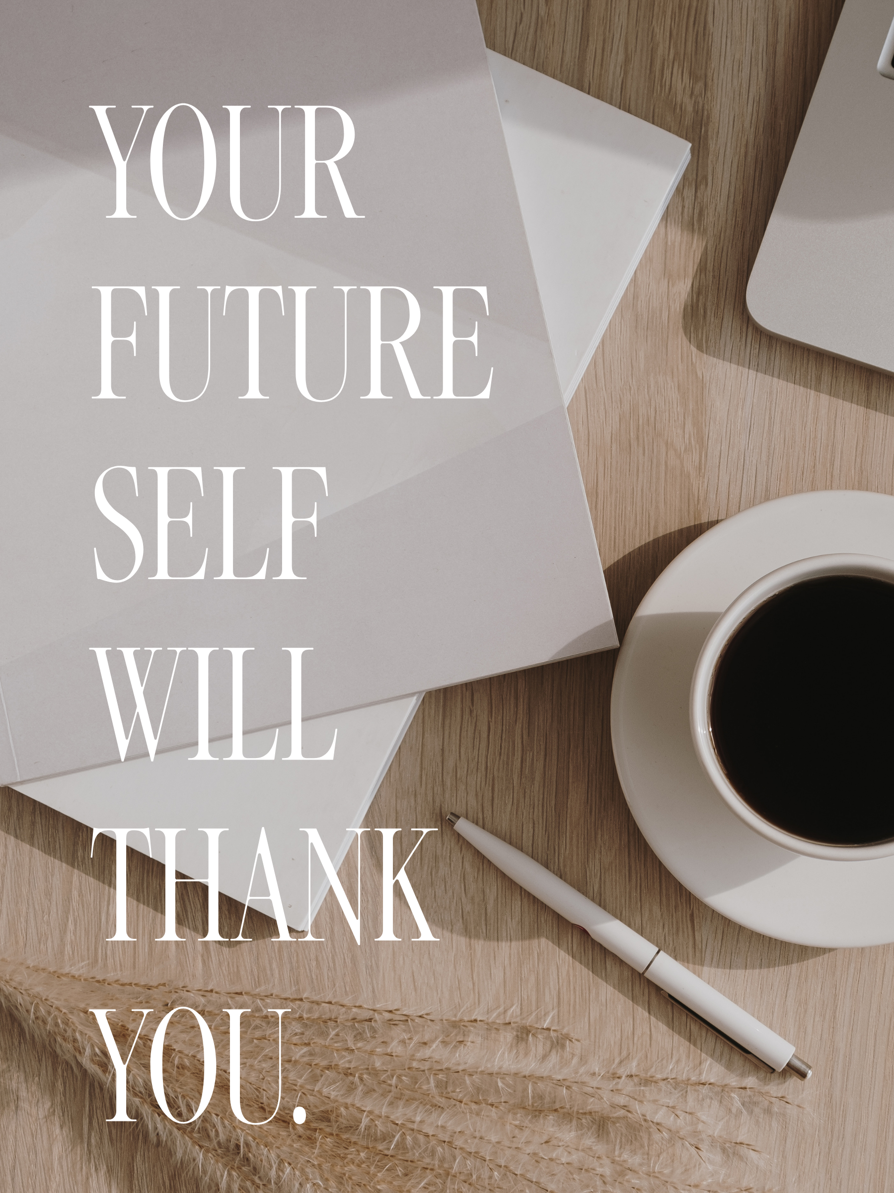 Overhead view of a workspace with a white laptop, cups of coffee on a saucer, a white pen, and some dried wheat on a wooden surface, with a motivational quote in large white letters that reads 'Your future self will thank you.'