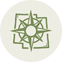 Stylized green and white compass rose emblem with geometric design