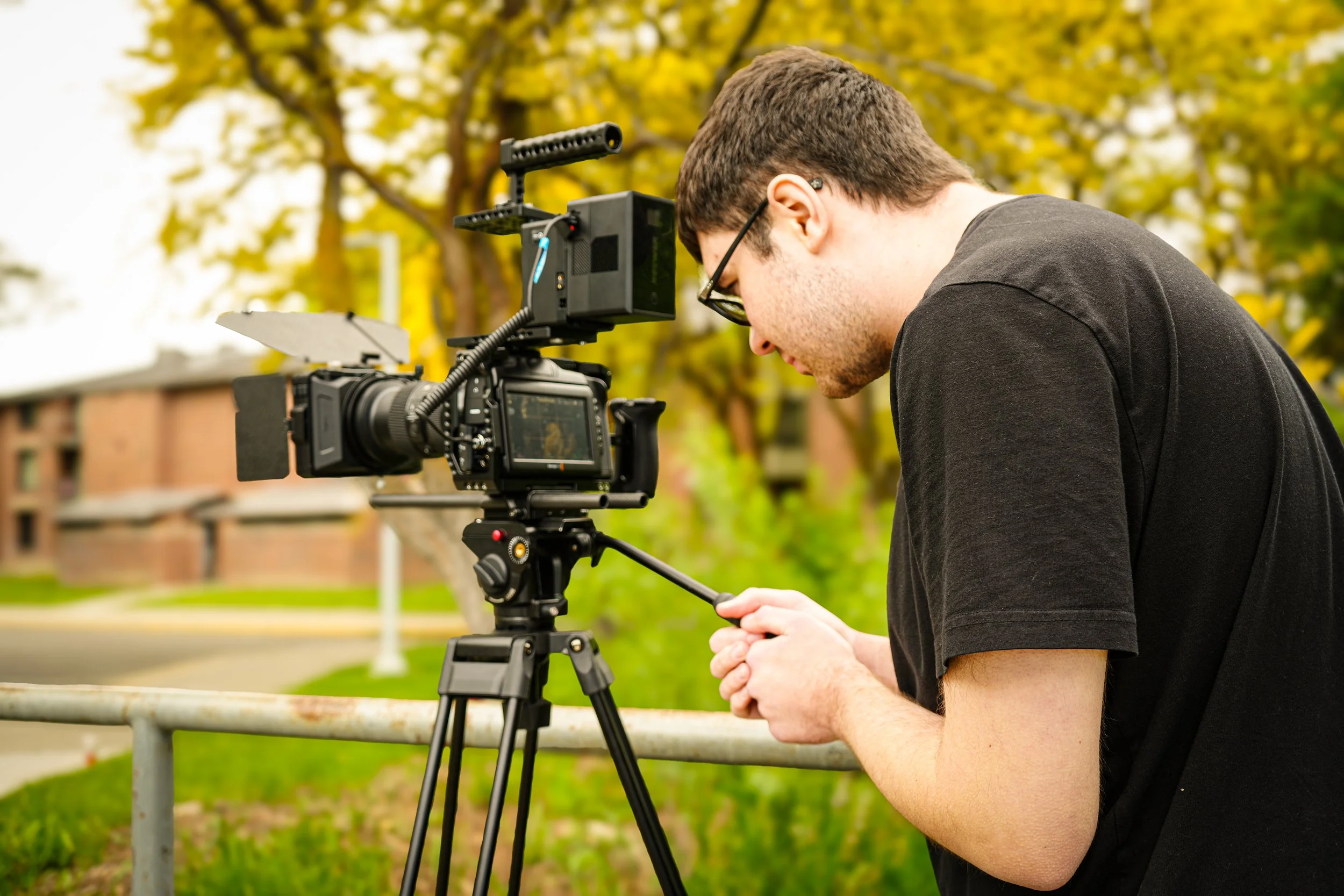 Professional cinematographer operating cinema camera for ARC Lens Productions production
