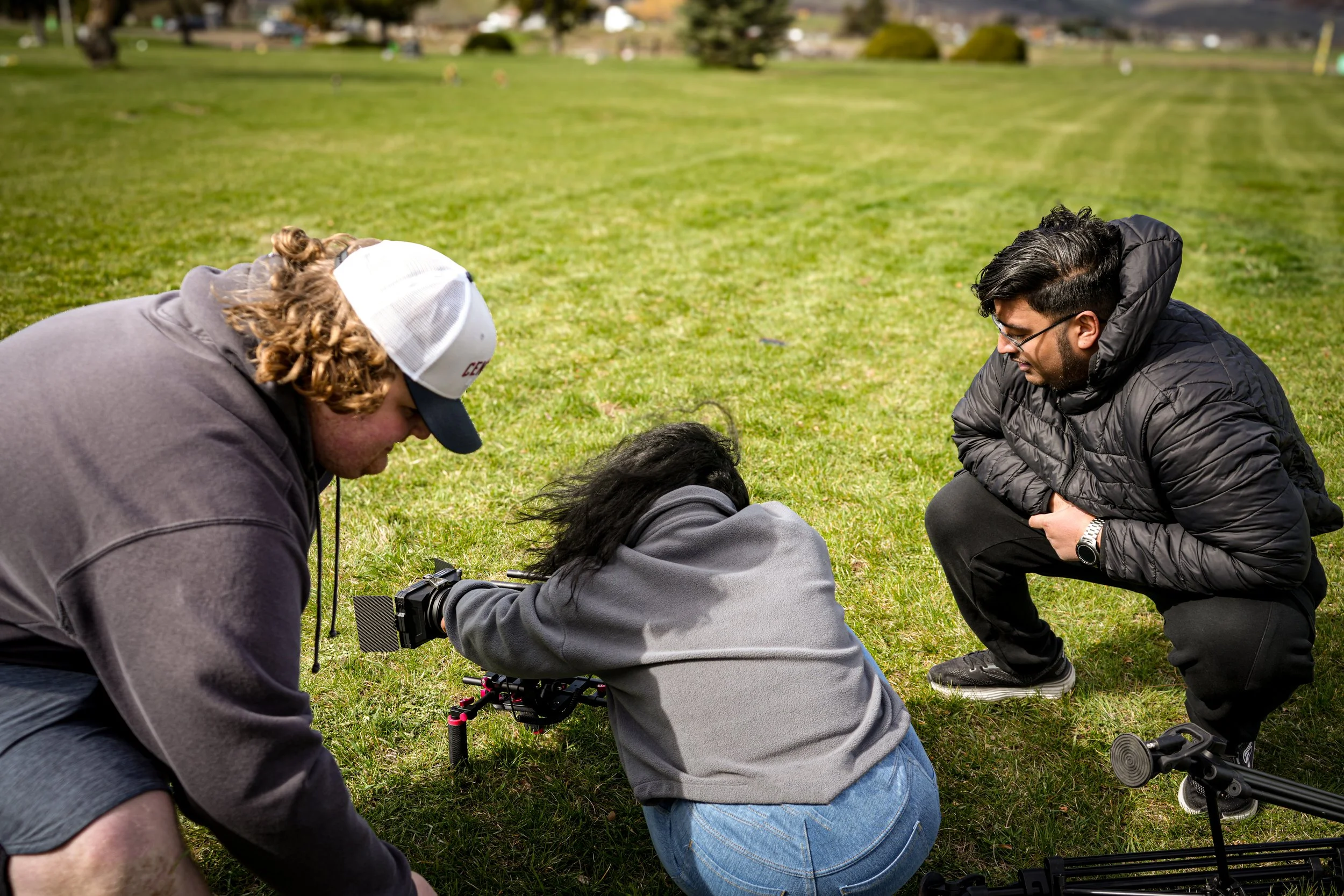 Behind the scenes collaborative film production setup for ARC Lens Productions narrative filmmaking as director Gurdil Dardi oversees.