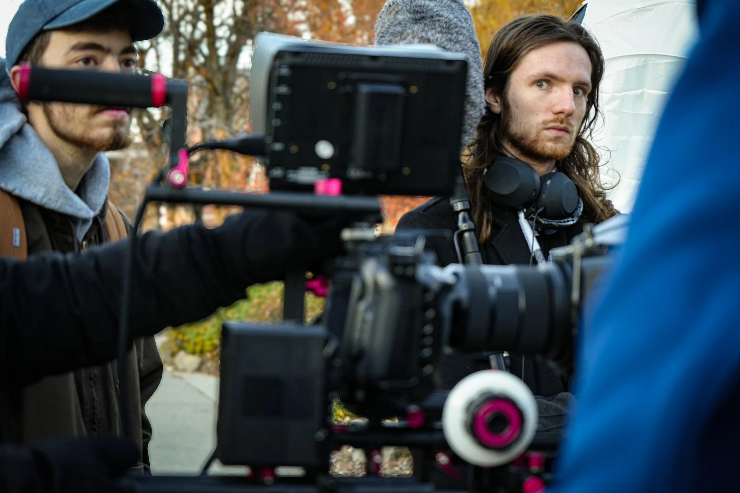 Professional cinematography team operating cinema camera during film production for ARC Lens Productions