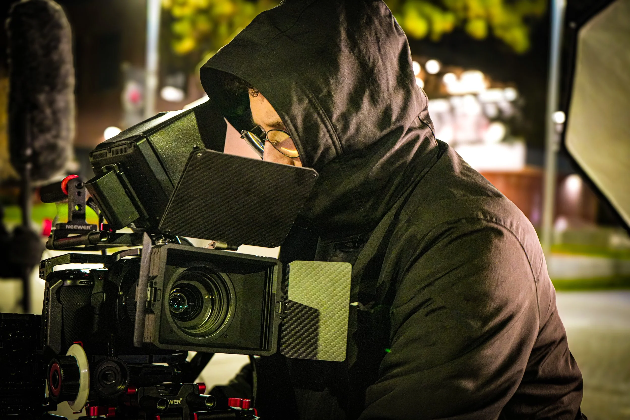 Cinematic camera operator using professional stabilization rig during ARC Lens Productions night production