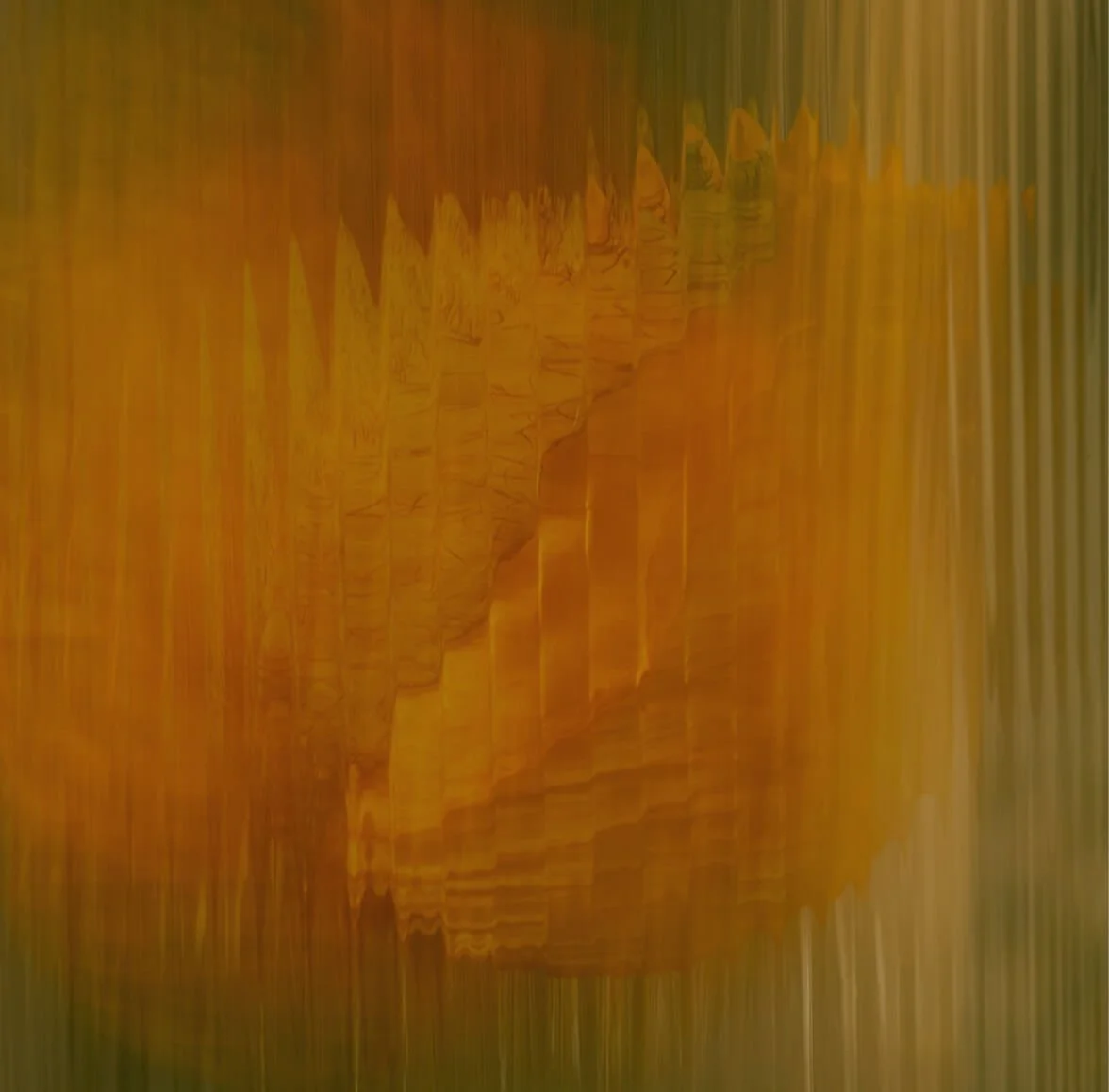 Abstract digital art with vertical streaks and warm colors, predominantly orange and yellow, creating a textured, layered appearance.