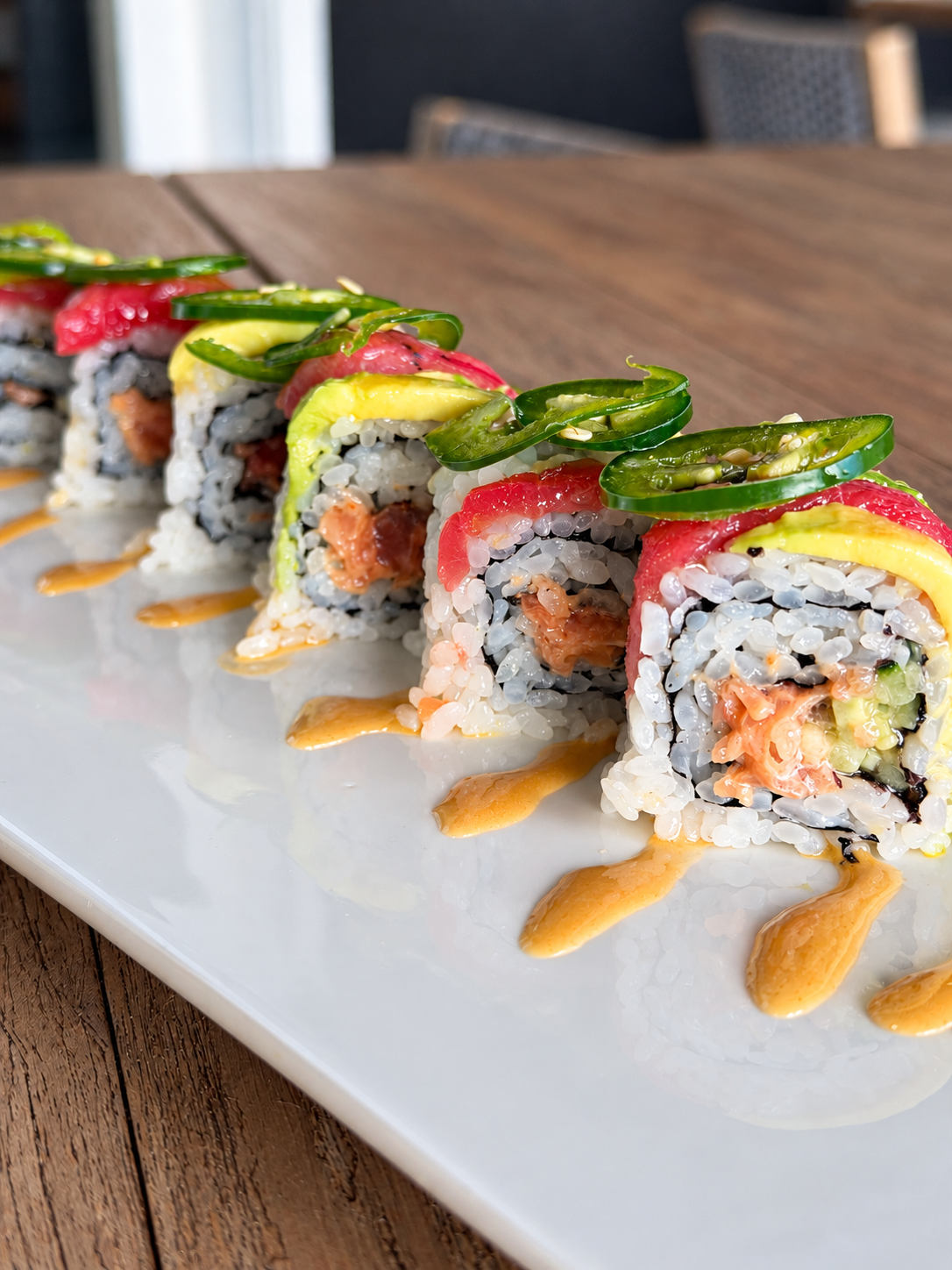 Vibrant Jalapeño-Topped Sushi Roll.png