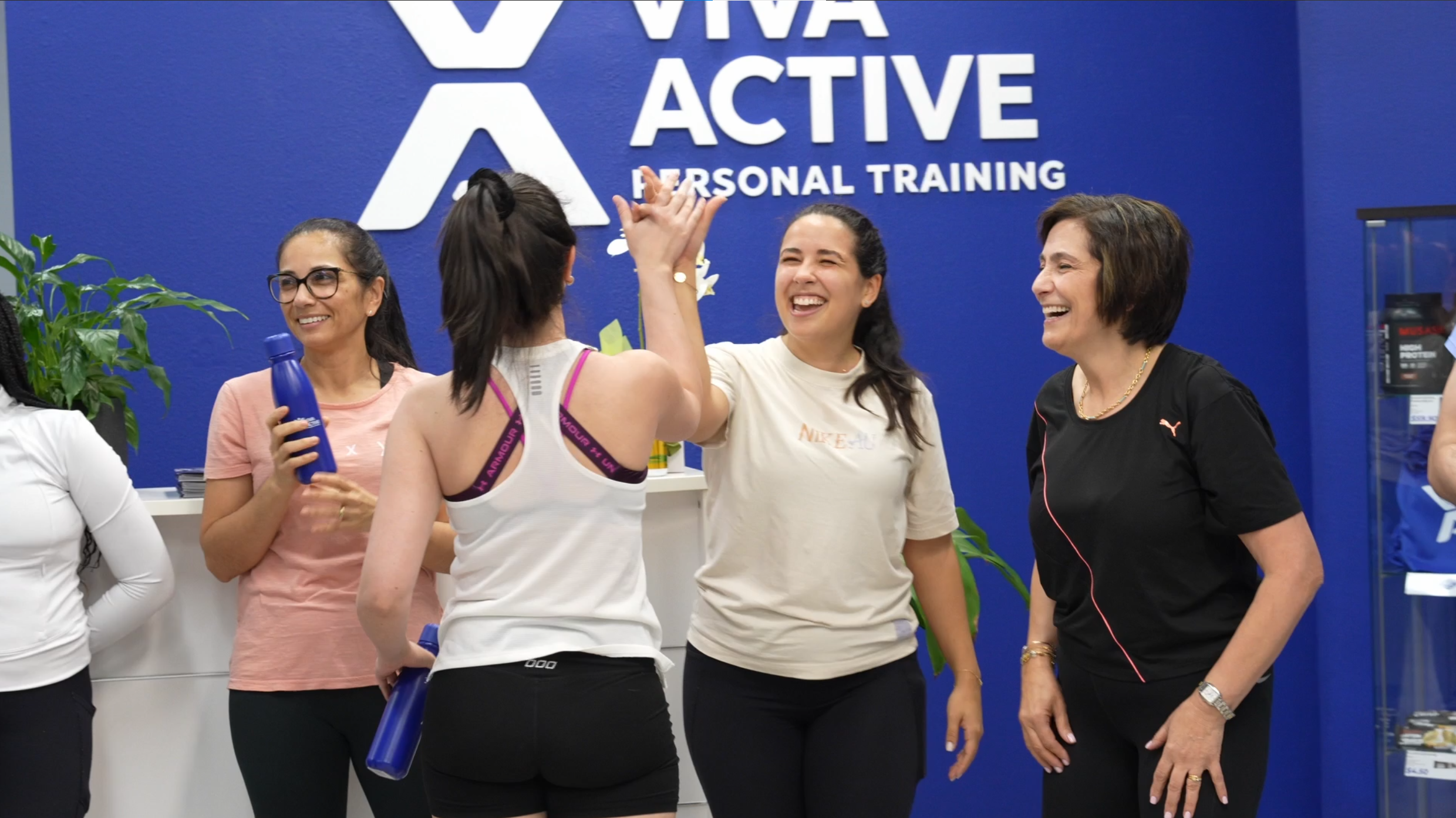 Viva Active clients high-fiving after a group fitness class at our Burwood studio