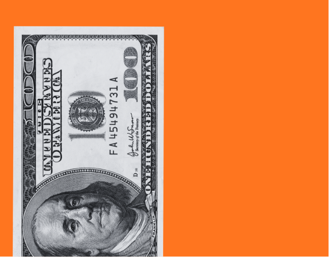 A 100-dollar bill placed on an orange background.