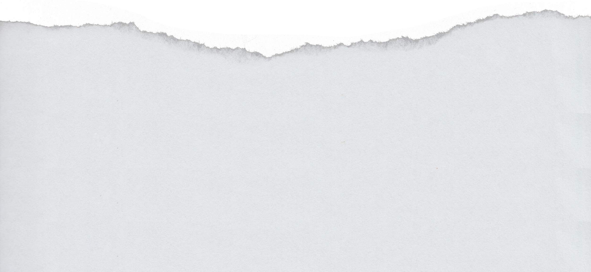 Close-up of torn paper with black top edge and white bottom section.