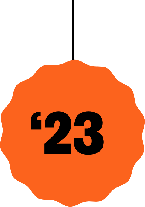 A large orange badge with the number 23 in bold black text, resembling a sports or event badge.