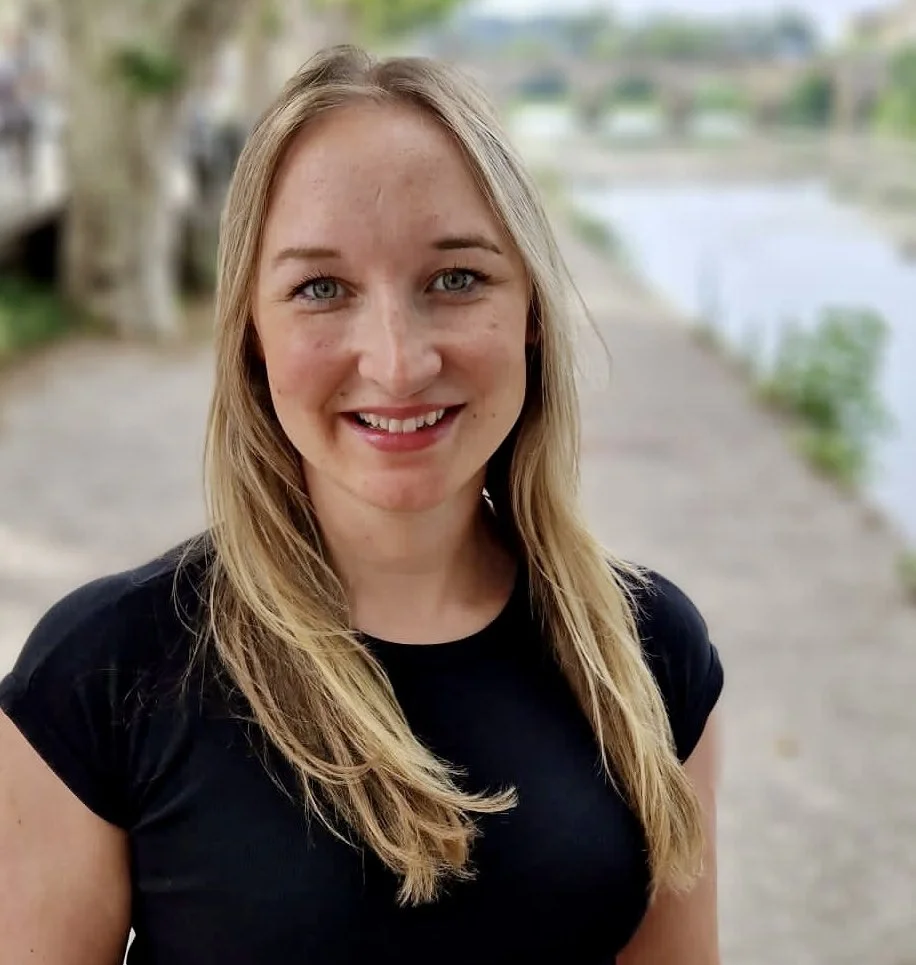 The lead counsellor, a young woman with blonde hair, smiling with a welcoming expression.