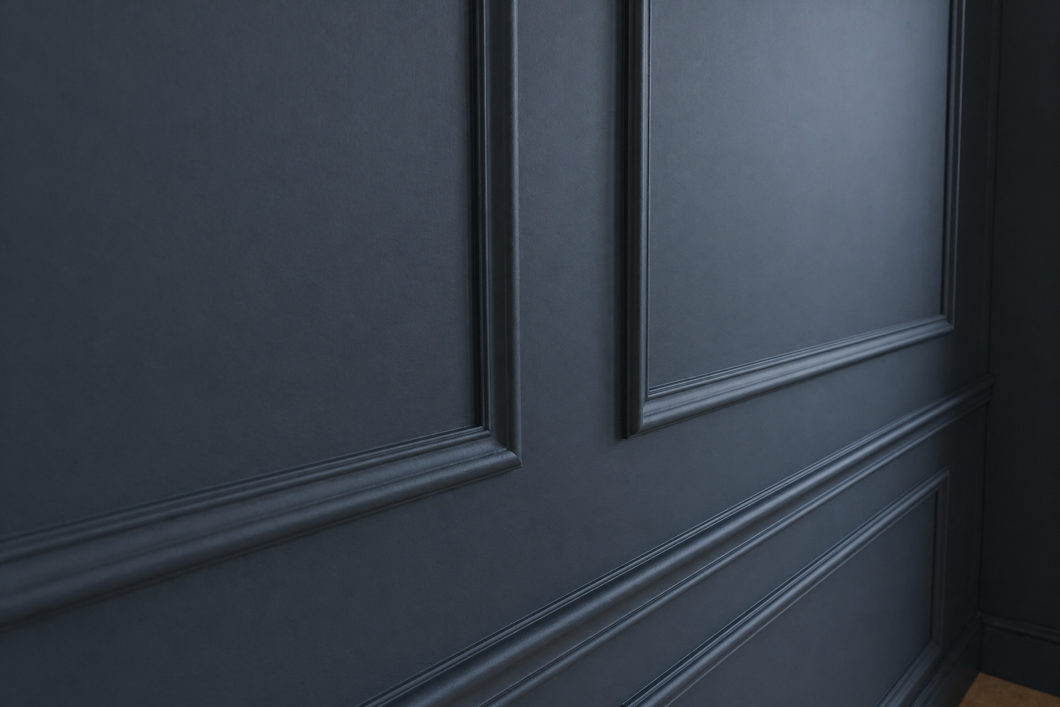 Close-up of a dark blue wainscoting wall with decorative molding.