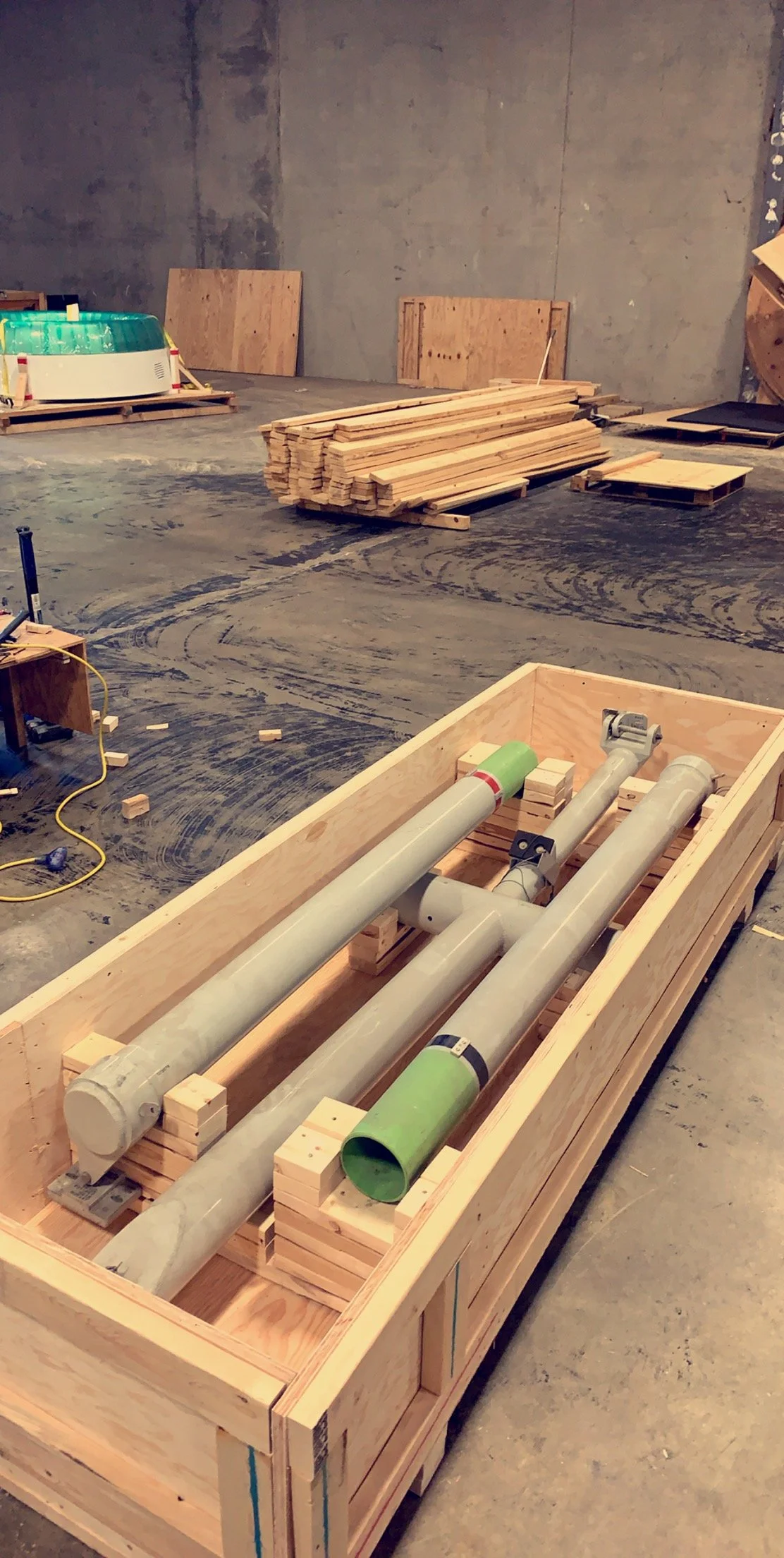 Hydraulic components secured and packaged inside a reinforced wooden crate for transport.