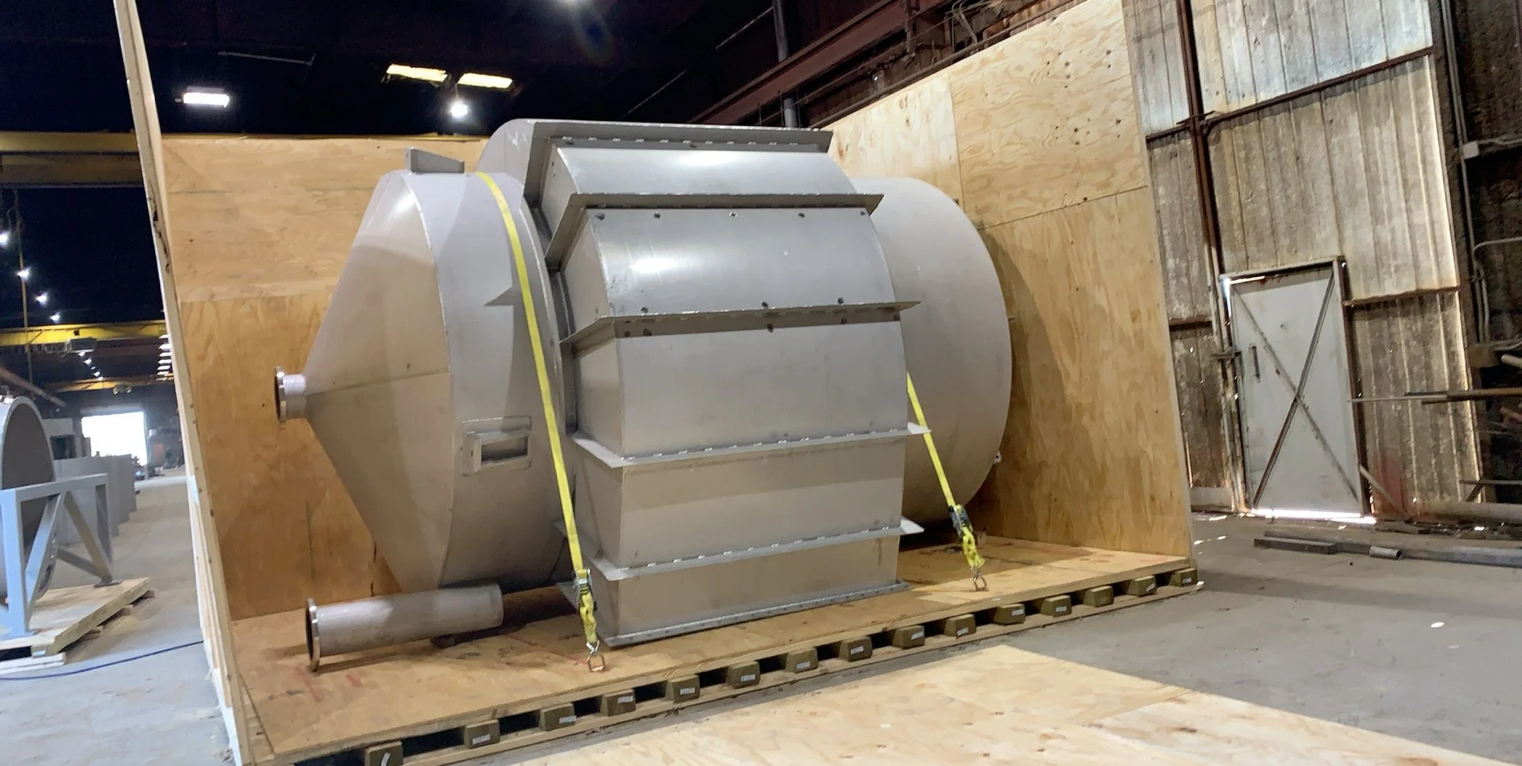 Custom skid base and framing designed for oversized equipment and forklift handling.