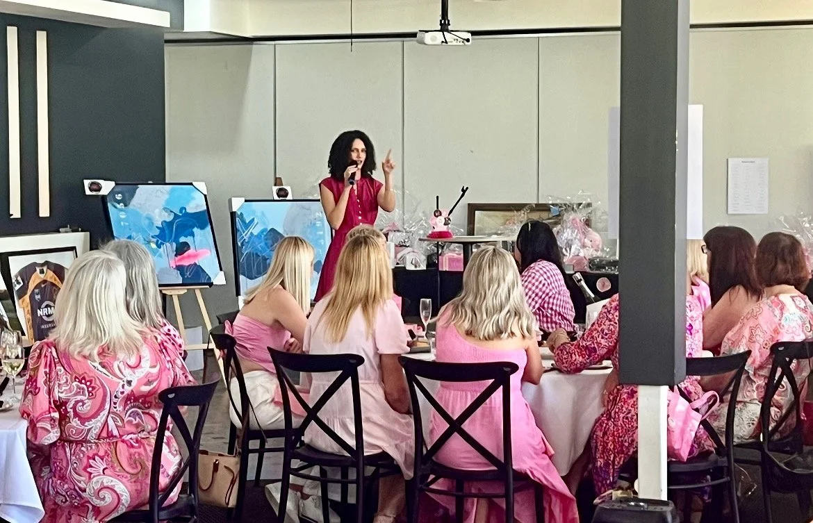 Jessica Erler speaking to a group of women at a workshop event