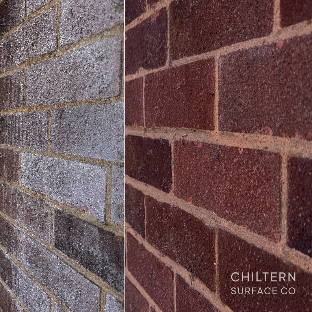 That white staining is efflorescence &mdash; When water gets into the brick it mixes with the salts and minerals contained. Then when the water evaporates it draws the salts out and deposits them on the surface. 
Whilst not intrinsically a structural