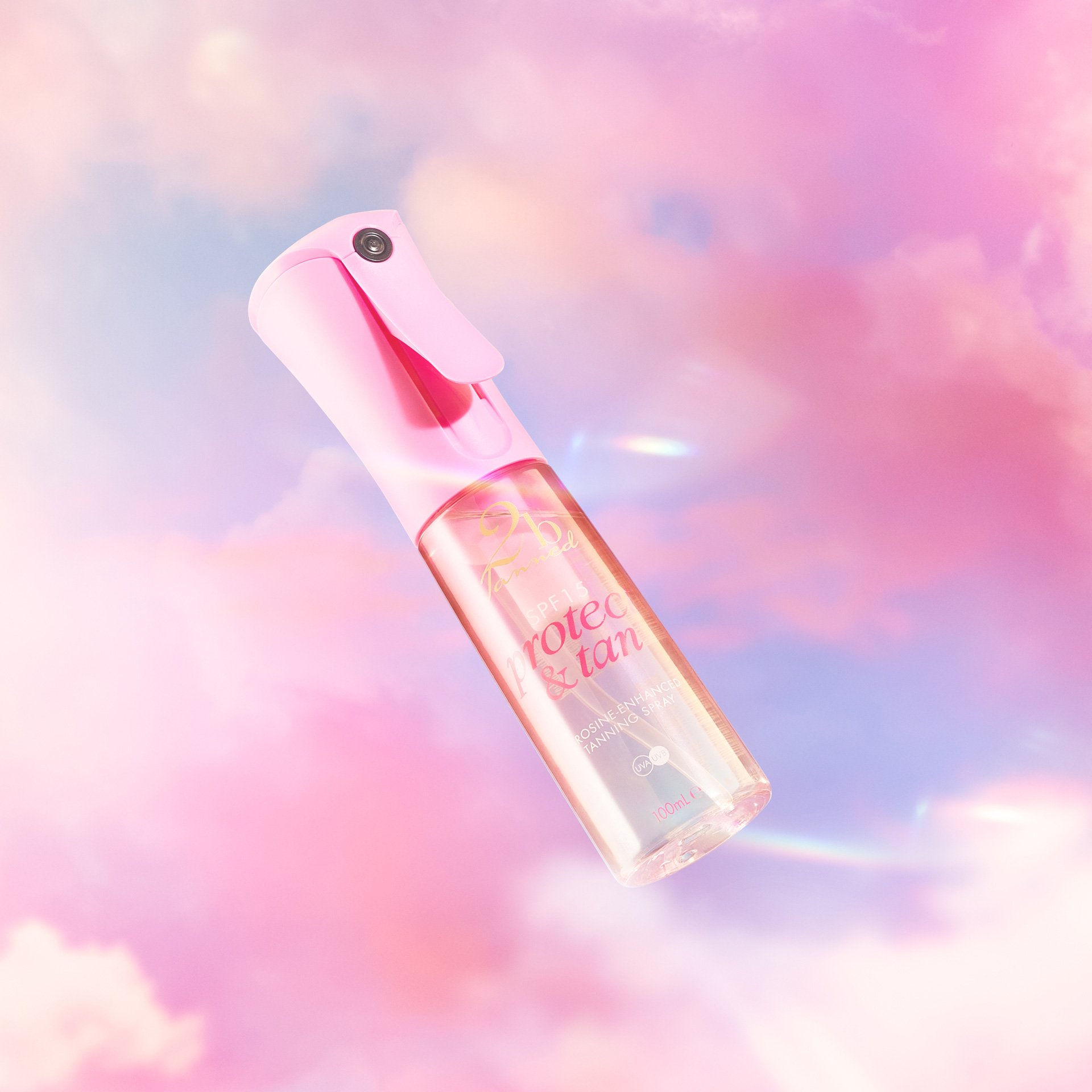 2bTanned Protect and Tan product, floating in the air between pink clouds.