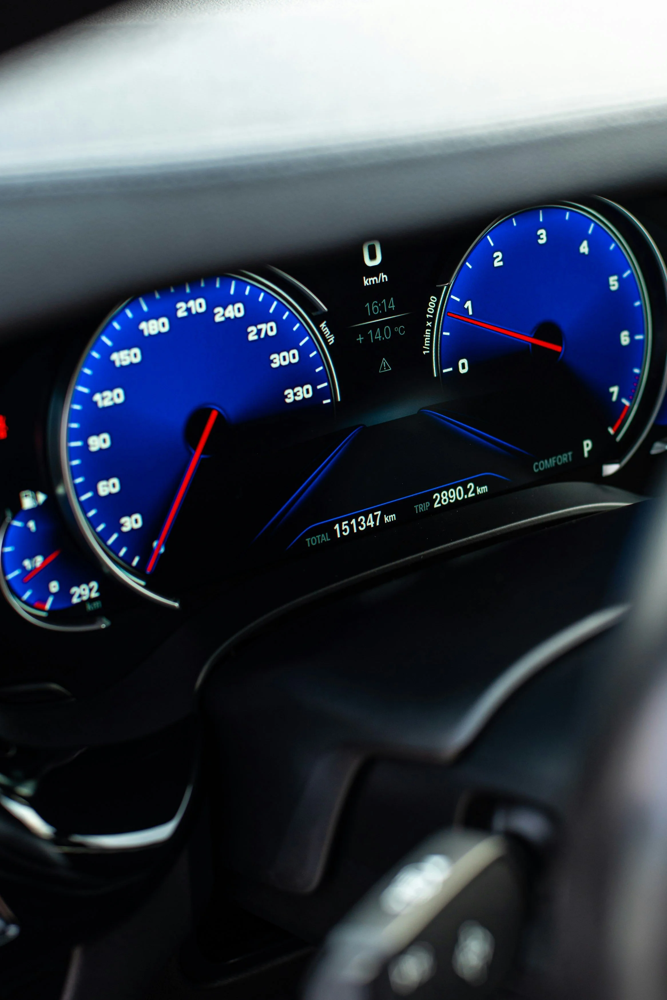 A digital car dashboard displaying speed, RPM, temperature, and trip information, with the total mileage at 151,347 km and trip distance at 2,890.2 km.