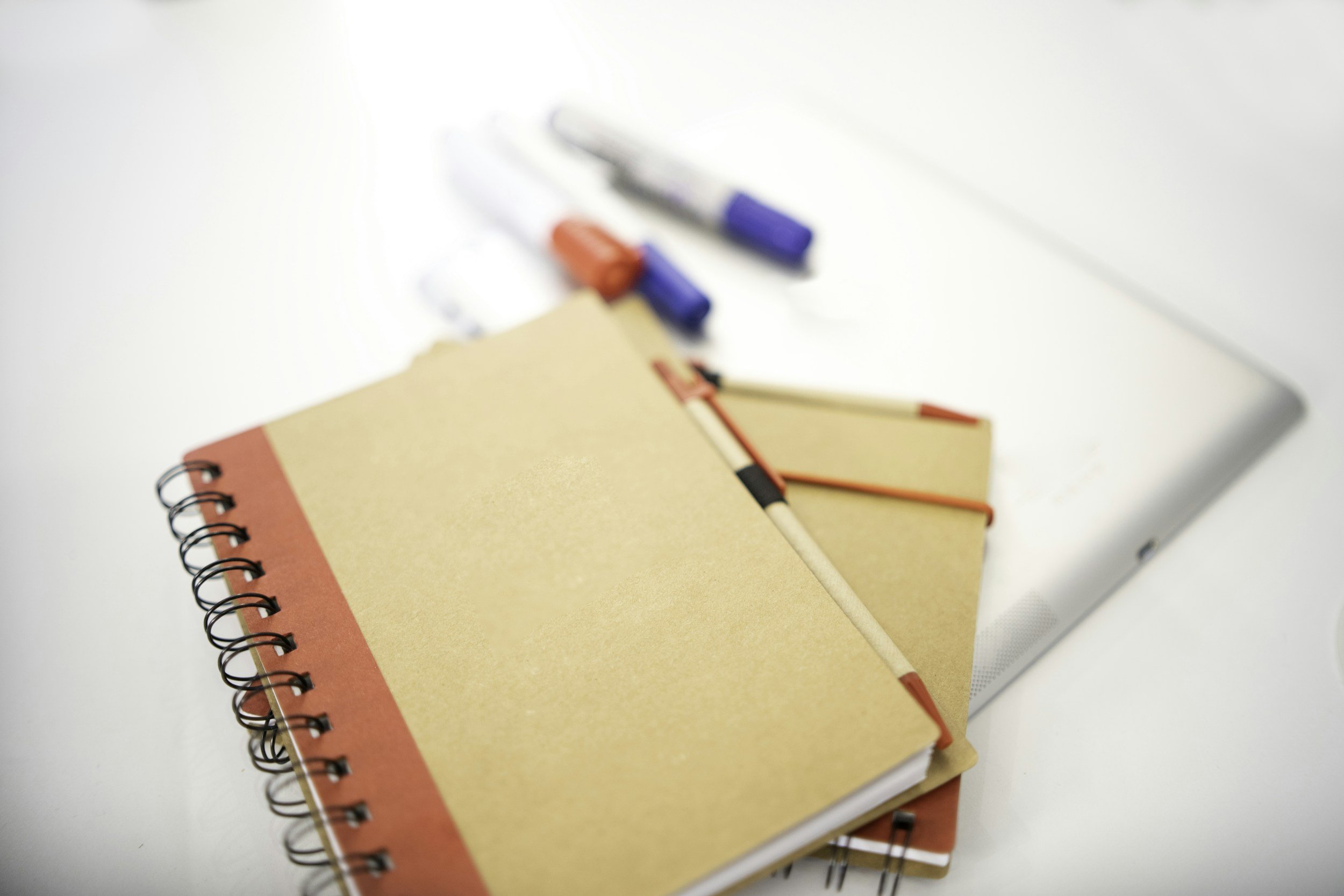 Notebook and colourful pens on a desk — MrBrill curriculum aligned resources for teachers parents and students