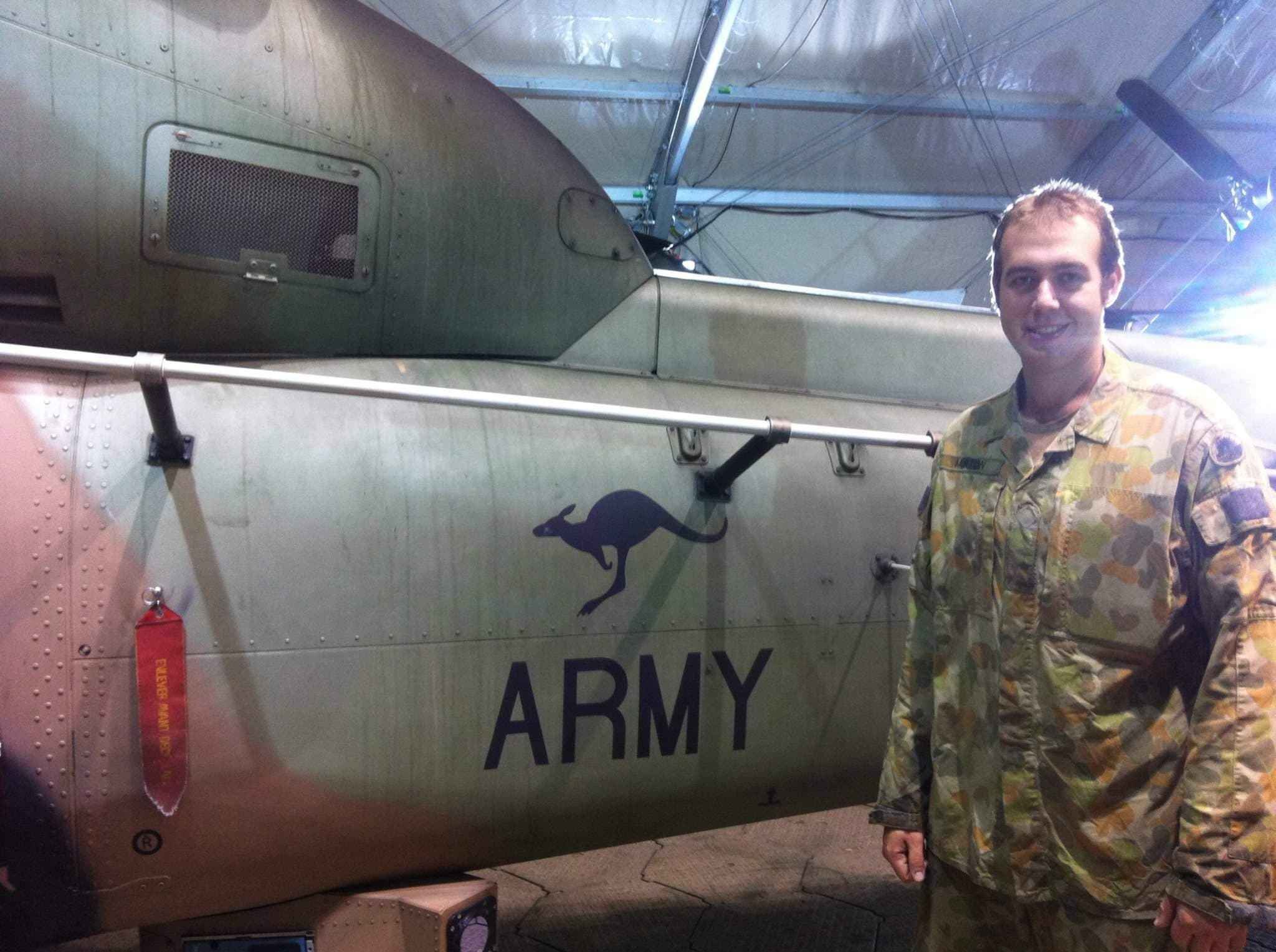 Australian Army veteran in uniform beside a military aircraft, the kind of veteran TAG Legal supports with DVA claims management across Australia