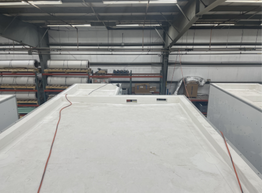 Commercial roofing materials inside an industrial warehouse