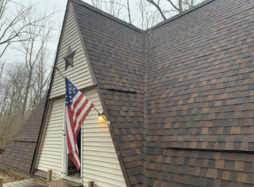 Completed asphalt shingle roof installation on a residential home