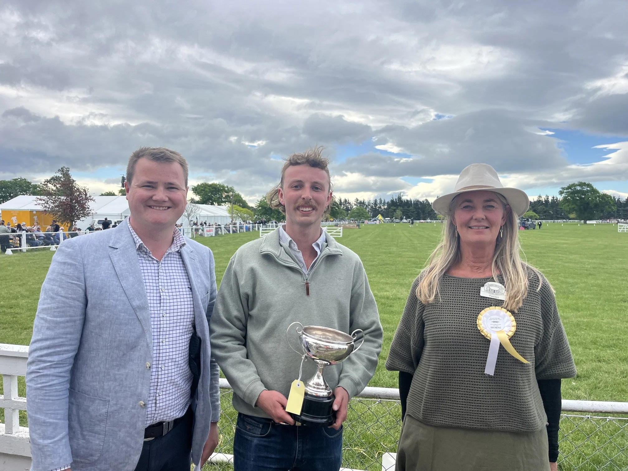 John Bailey and President Tracy McIlraith presenting Nigel Greenwood the Long Service Award