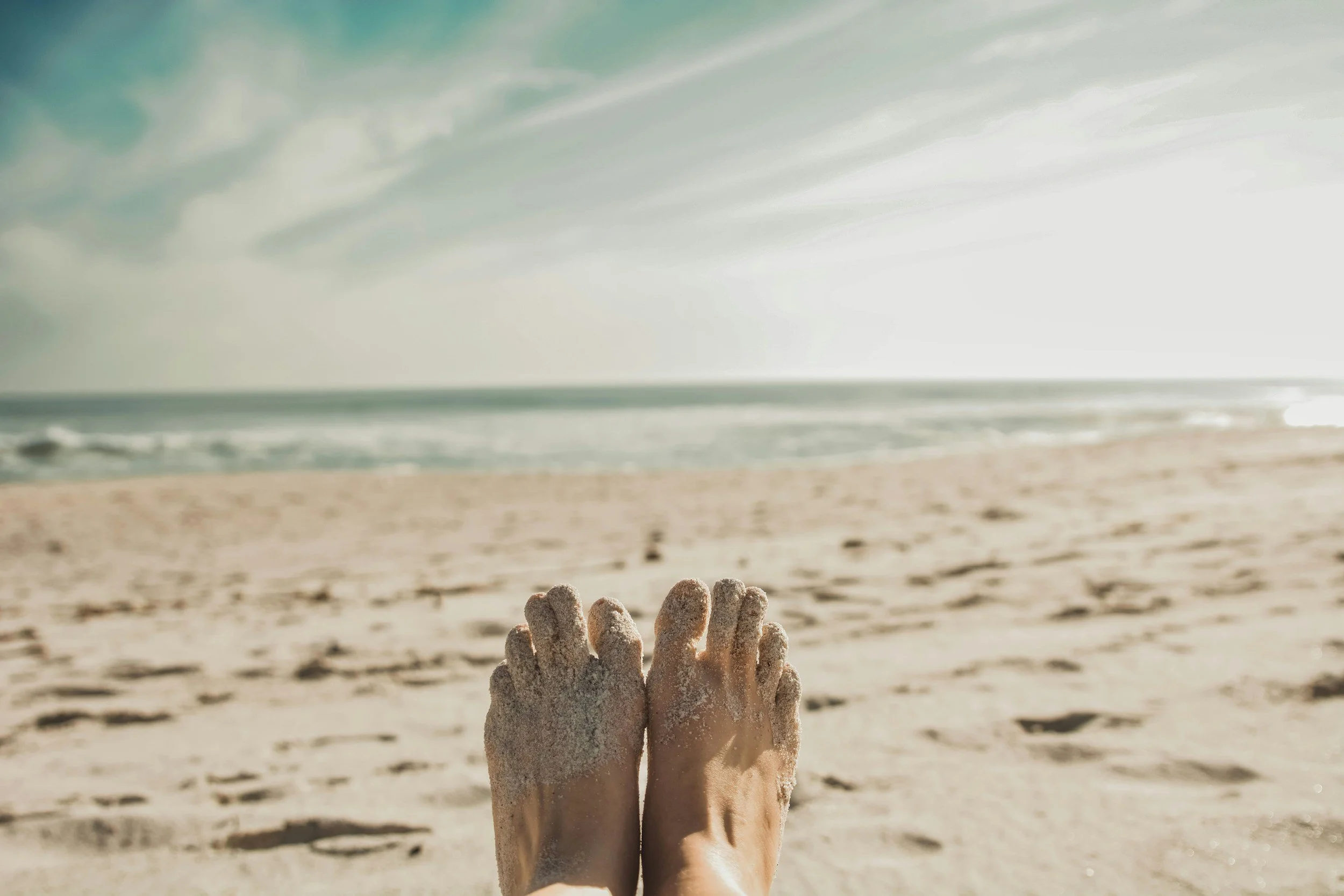 Dry Feet with callus cracked heels at the beach