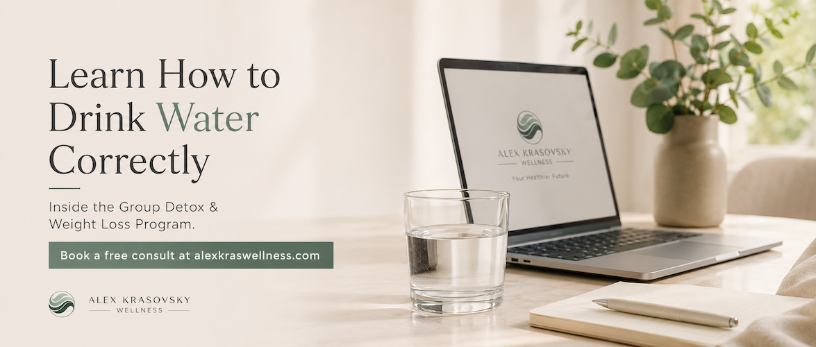 Wellness coaching desk with glass of water, laptop, and notebook promoting how to drink water correctly in the Group Detox and Weight Loss Program
