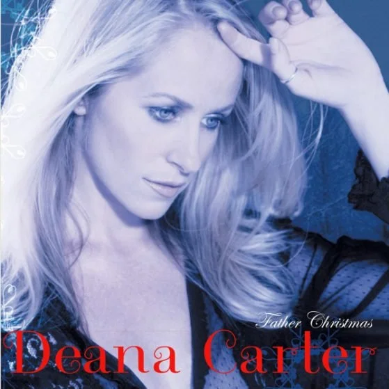 A woman with long blonde hair looking down, wearing a black top, with text that says 'Father Christmas' and 'Deana Carter'.