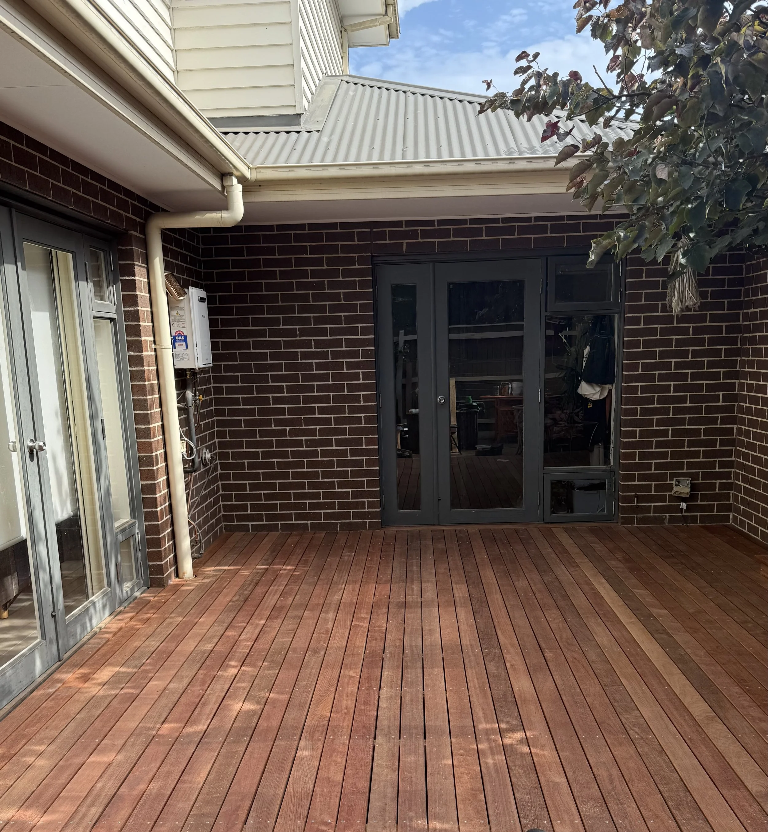 our client had a deck that was in disrepair after a 15 year long battle with harsh summers and bitter winters that were further exacerbated by moister pooling around the outdoor water feature. 

After pulling up the old deck, we quite unfortunately, 