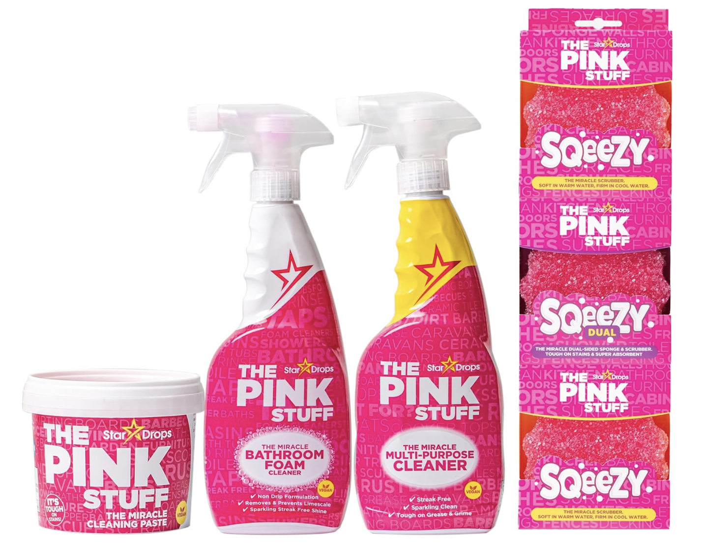 Pink cleaning products including a bathroom foam cleaner and multi-purpose cleaner in spray bottles, a pink cleaning paste in a tub, and a dual-sided sponge with a scrubber in bright pink packaging.