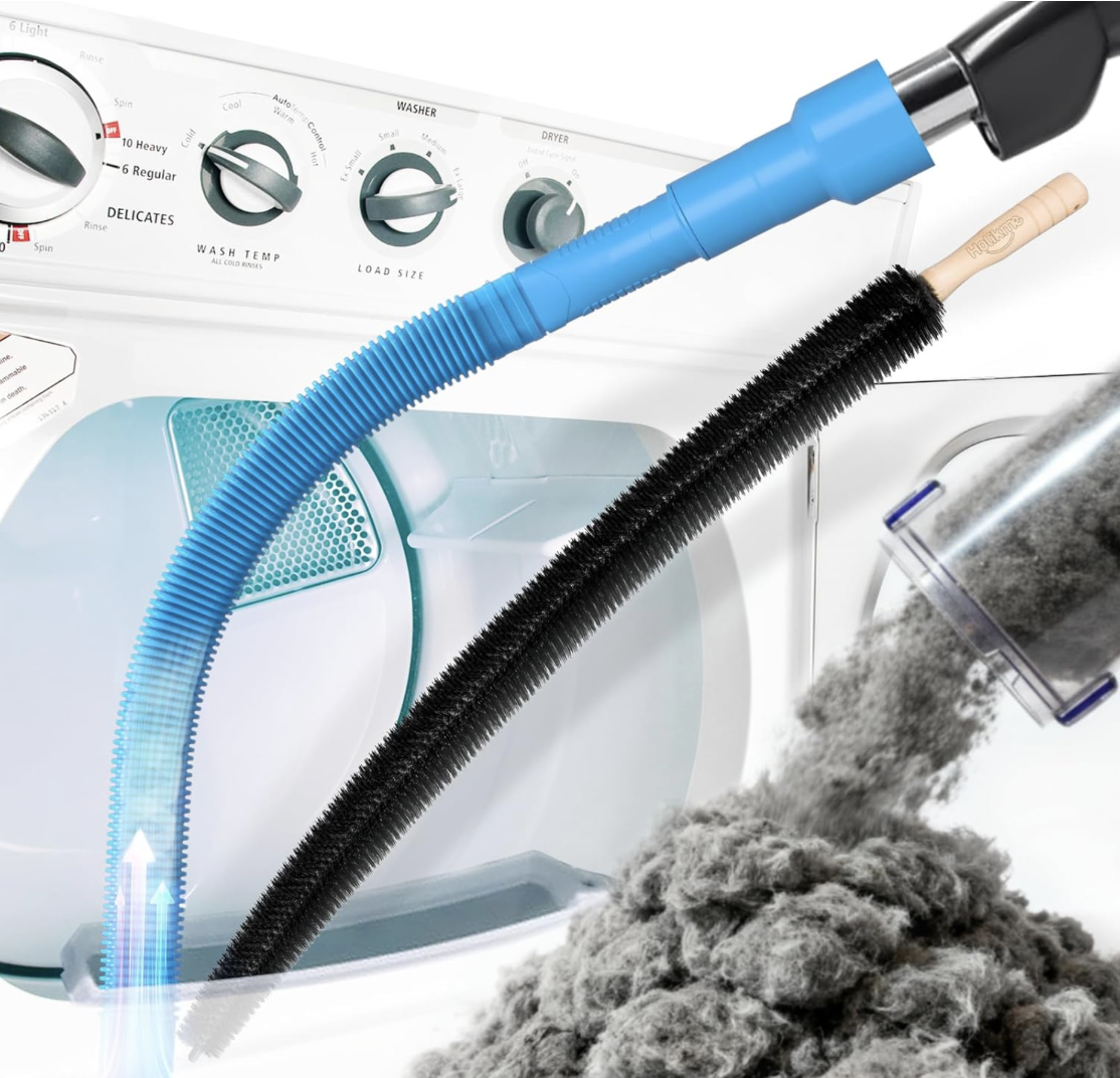 A washing machine with two vacuum hoses attached and dust being vacuumed up.